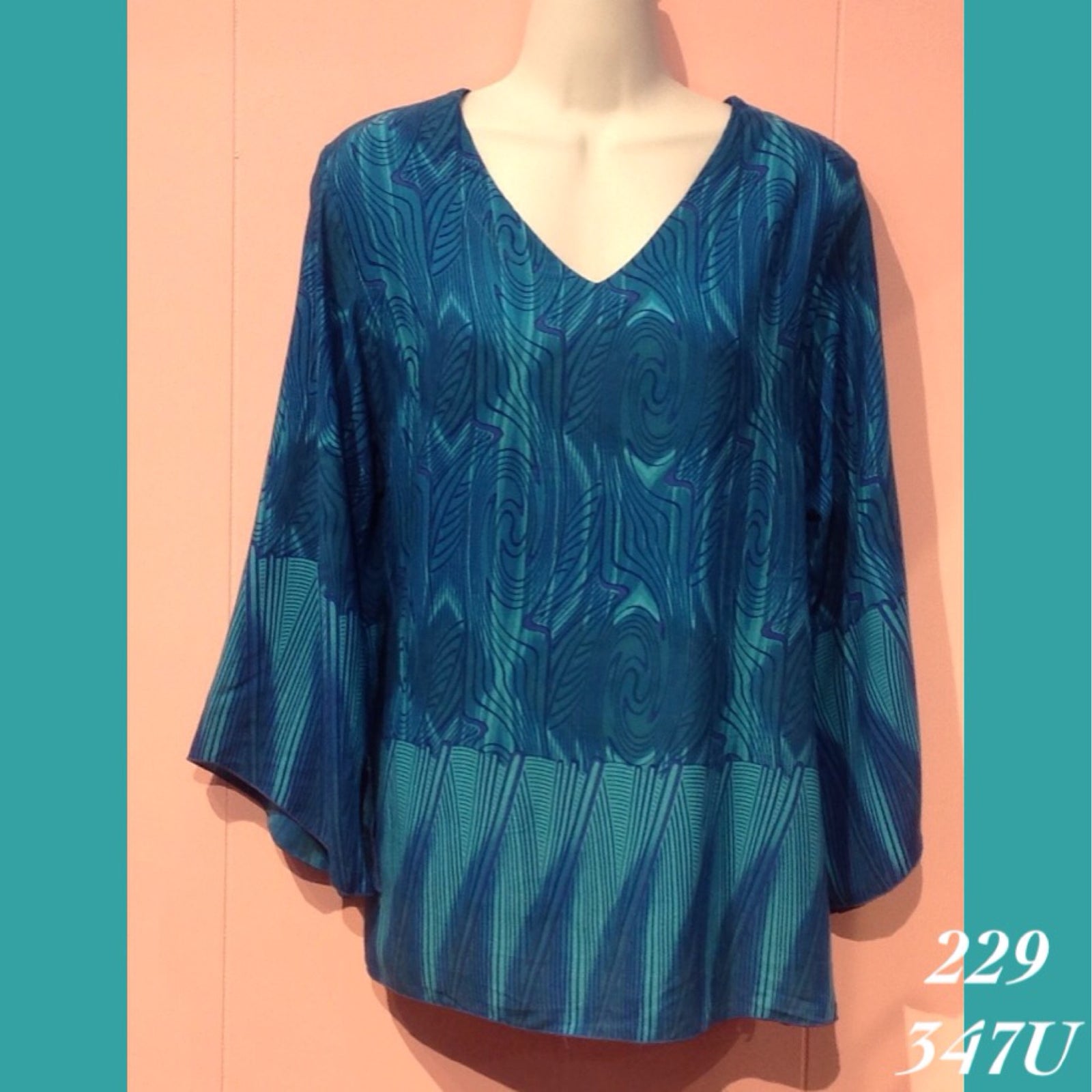 229 - 347U , V neck tunic top with 3/4 sleeve